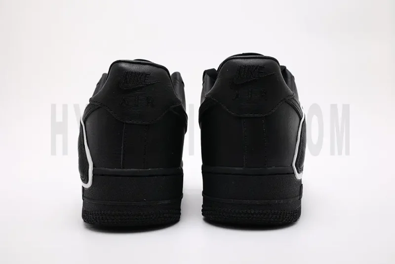 a pair of black sneakerss