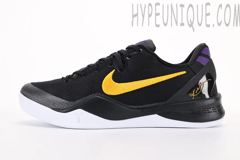 a black and yellow tennis shoe