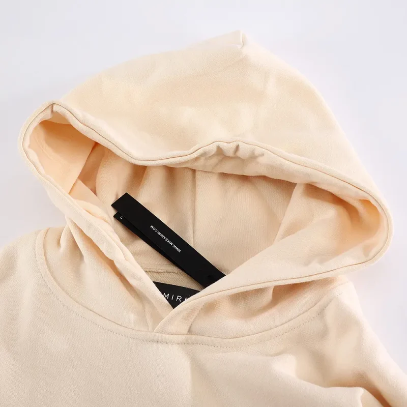 the beige hoodie