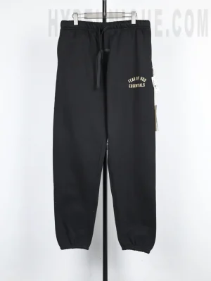 the black Fear of God Essentials Heavy Fleece Sweatpant