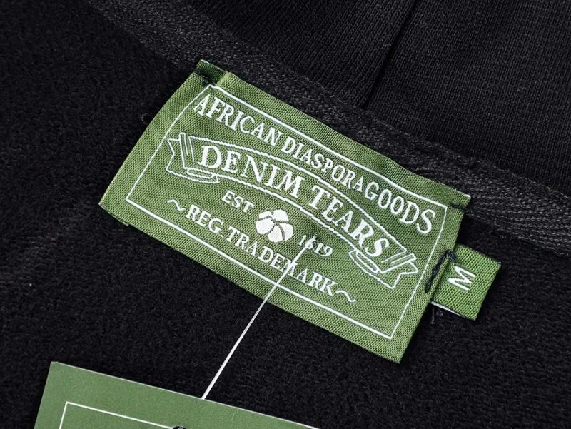 the denim tears brand label