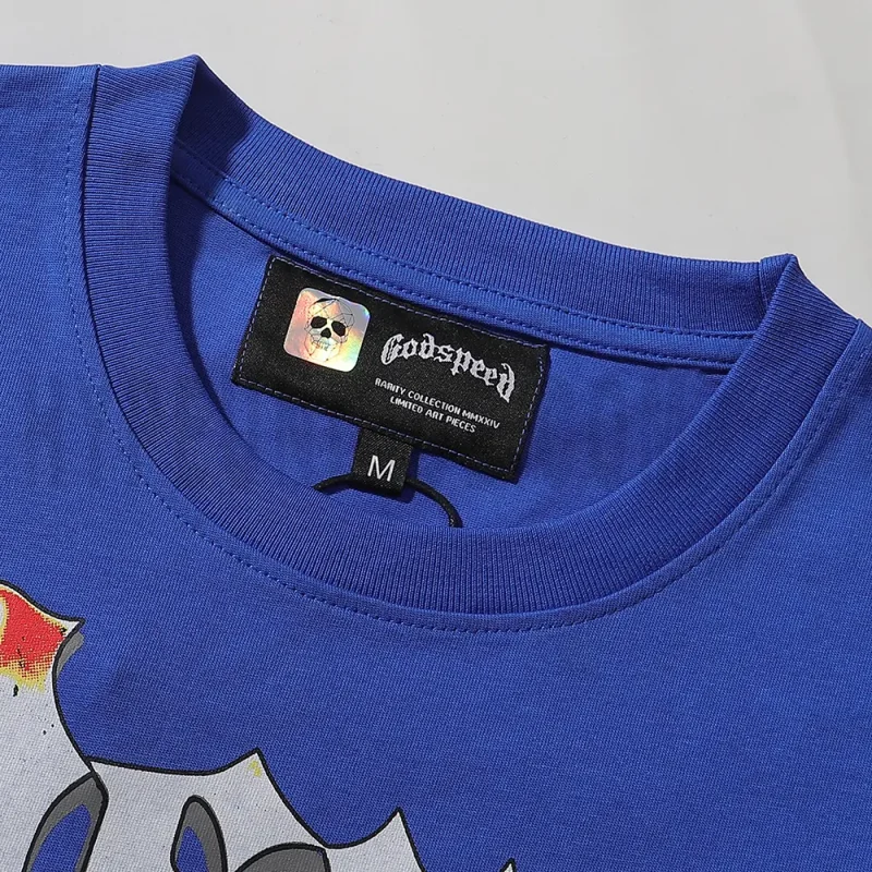 Detailed close-up of the tee's neck label, featuring wash care instructions and subtle brand branding in a clean, minimalist typography