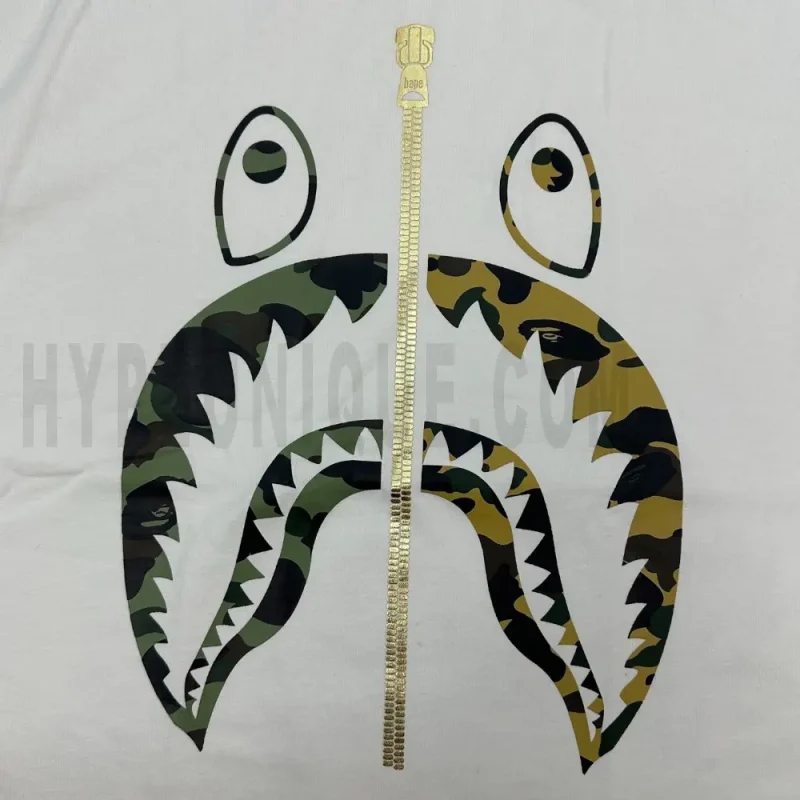 Detailed shot capturing the graphic print on the white tee's front panel.