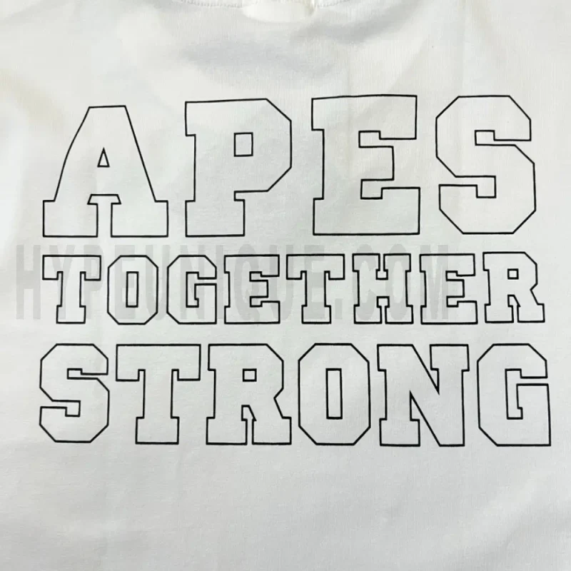 Detailed shot capturing the graphic print on the white tee's back panel.