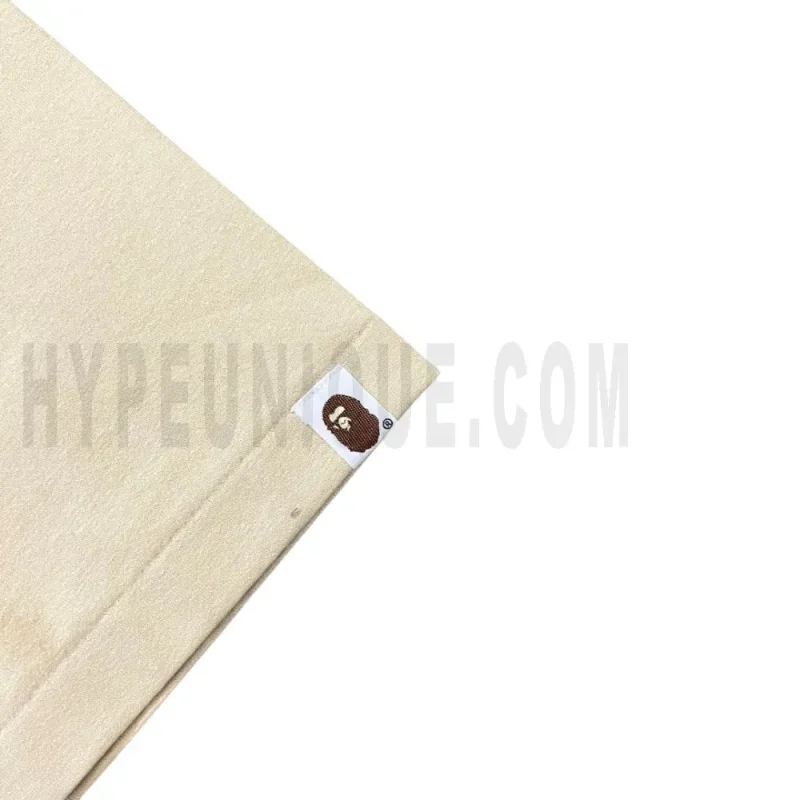 The sleeves of the beige clothes