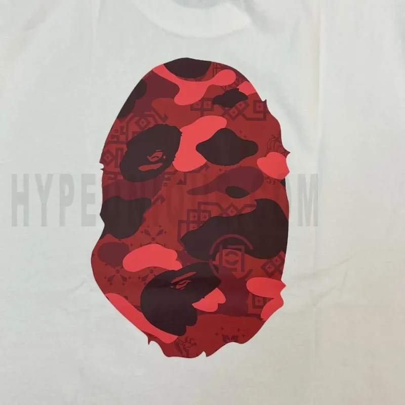 Detailed shot capturing the graphic print on the white tee's back panel.
