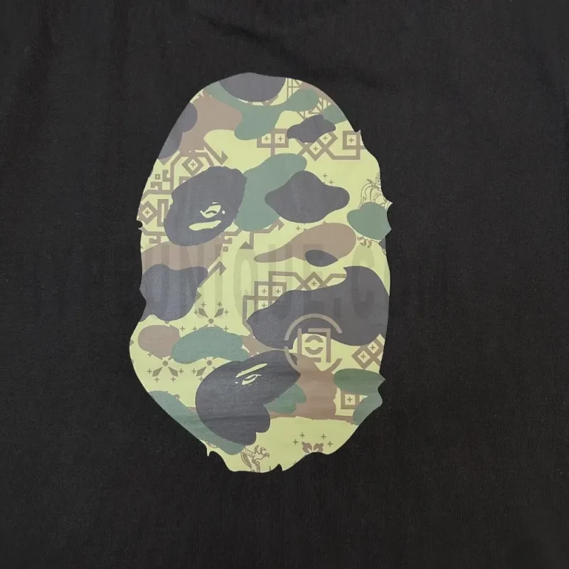 Detailed shot capturing the graphic print on the black tee's back panel.