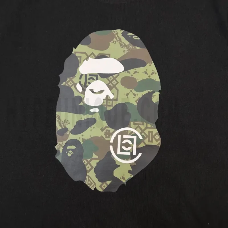 Detailed shot capturing the graphic print on the black tee's front panel.