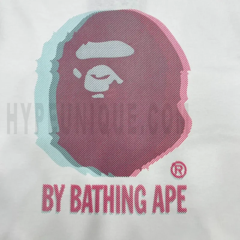 Detailed shot capturing the graphic print on the white tee's front panel.