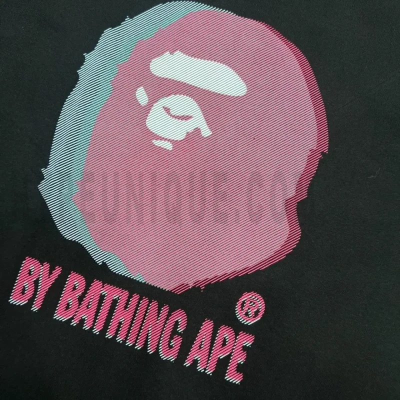 Detailed shot capturing the graphic print on the black tee's front panel.