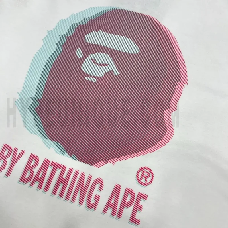 Detailed shot capturing the graphic print on the white tee's front panel.