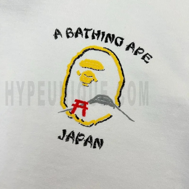 Close-up of the T-shirt embroidered details of the front of the white clothes.