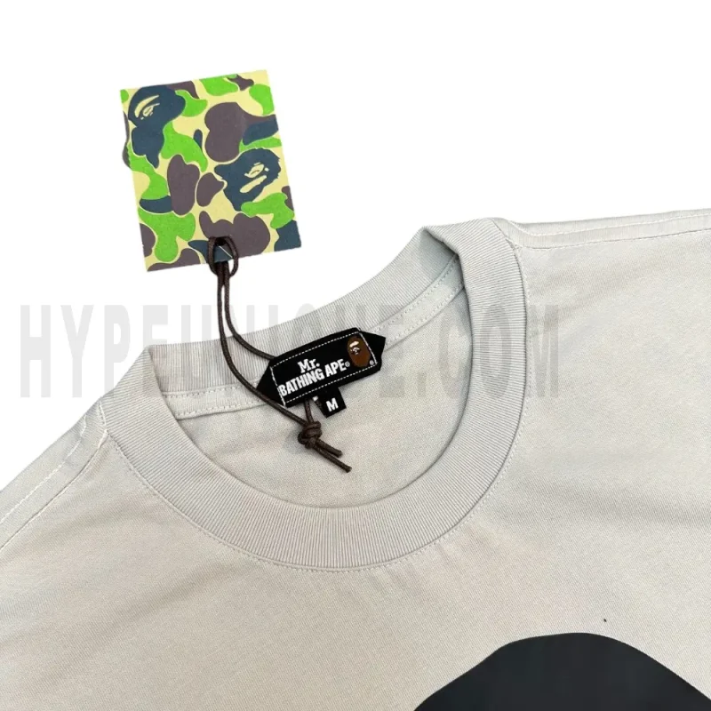 Neckline tag close-up, displaying garment care symbols and brand information with fashion-forward presentation.