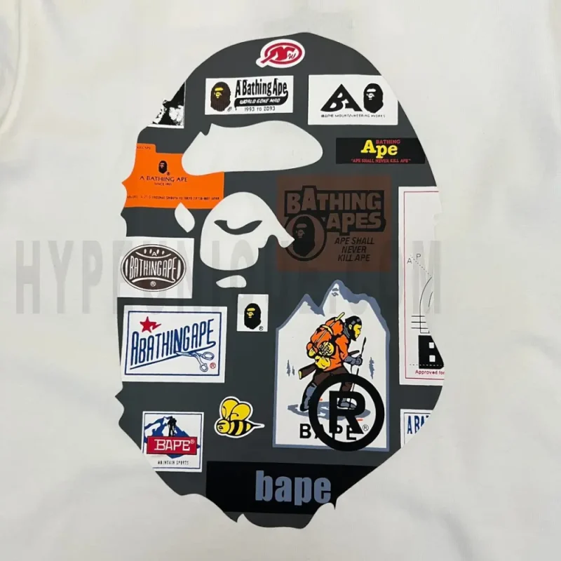 Detailed shot capturing the graphic print on the white tee's front panel.