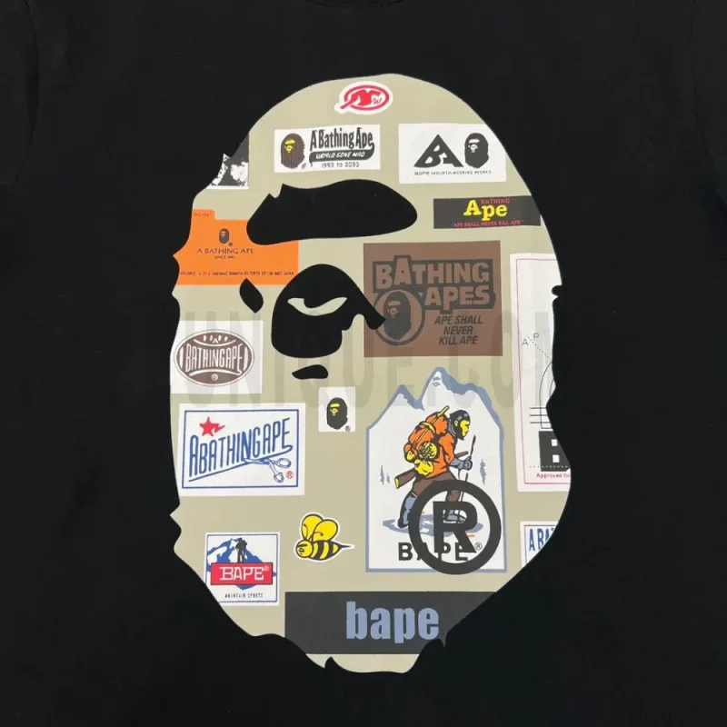 Detailed shot capturing the graphic print on the black tee's front panel.