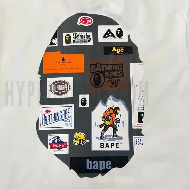 Detailed shot capturing the graphic print on the white tee's back panel.