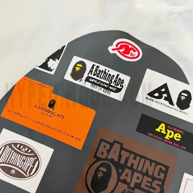 Detailed shot capturing the graphic print on the white tee's front panel.