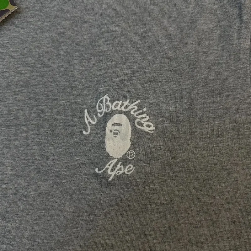Close-up of the T-shirt print details of the front of the gray clothes.