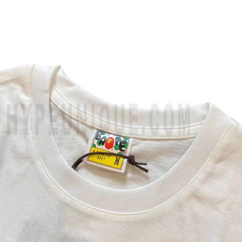 Neckline tag close-up, displaying garment care symbols and brand information with fashion-forward presentation.