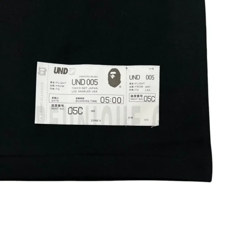Small graphic detail on the front of the shirt.