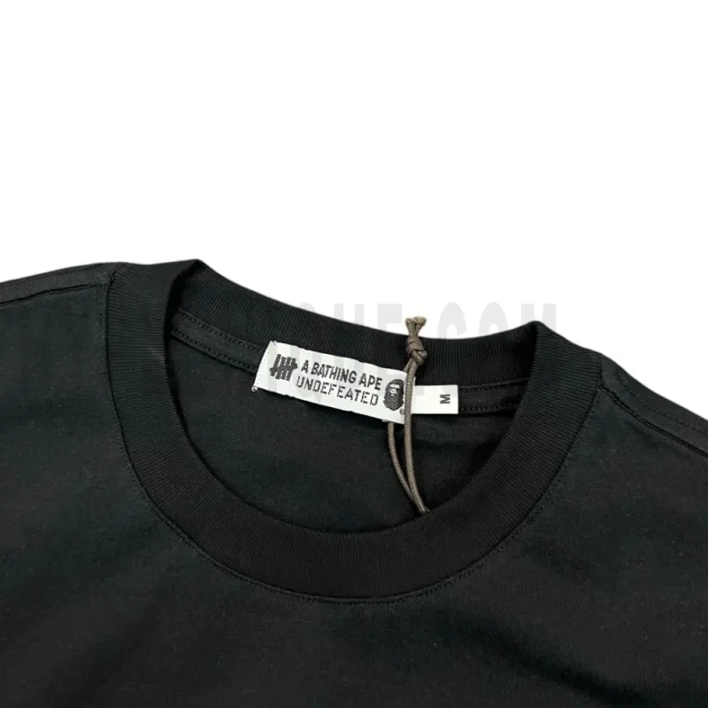 Neckline tag close-up, displaying garment care symbols and brand information with fashion-forward presentation.