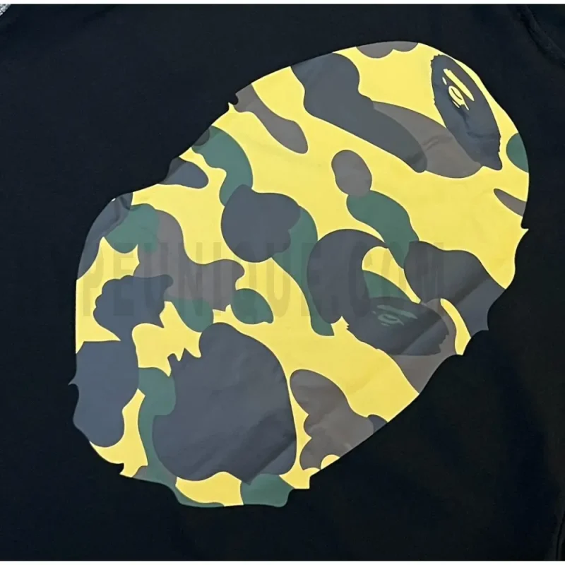 Detailed shot capturing the graphic print on the black tee's back panel.