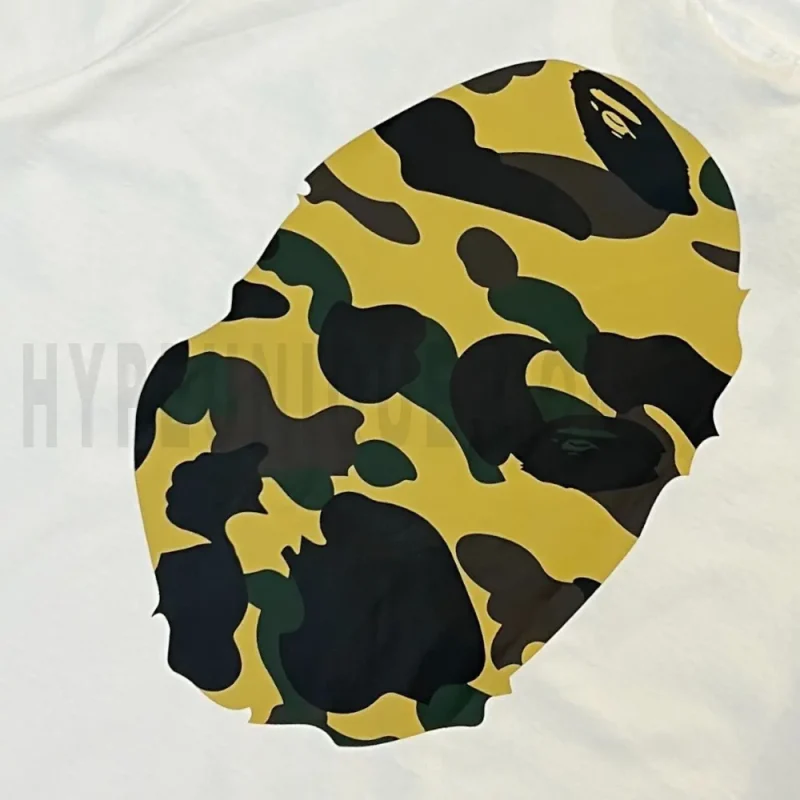 Detailed shot capturing the graphic print on the white tee's back panel.