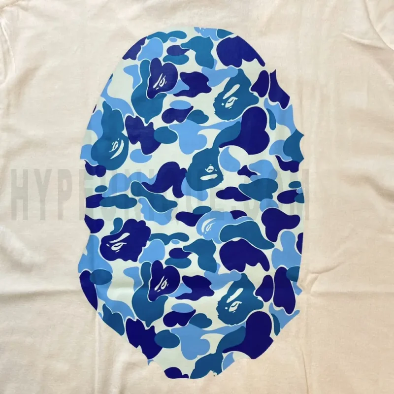 Detailed shot capturing the graphic print on the white tee's back panel.