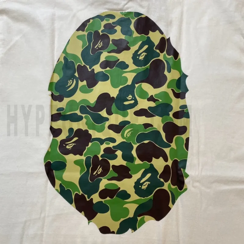 Detailed shot capturing the graphic print on the white tee's back panel.