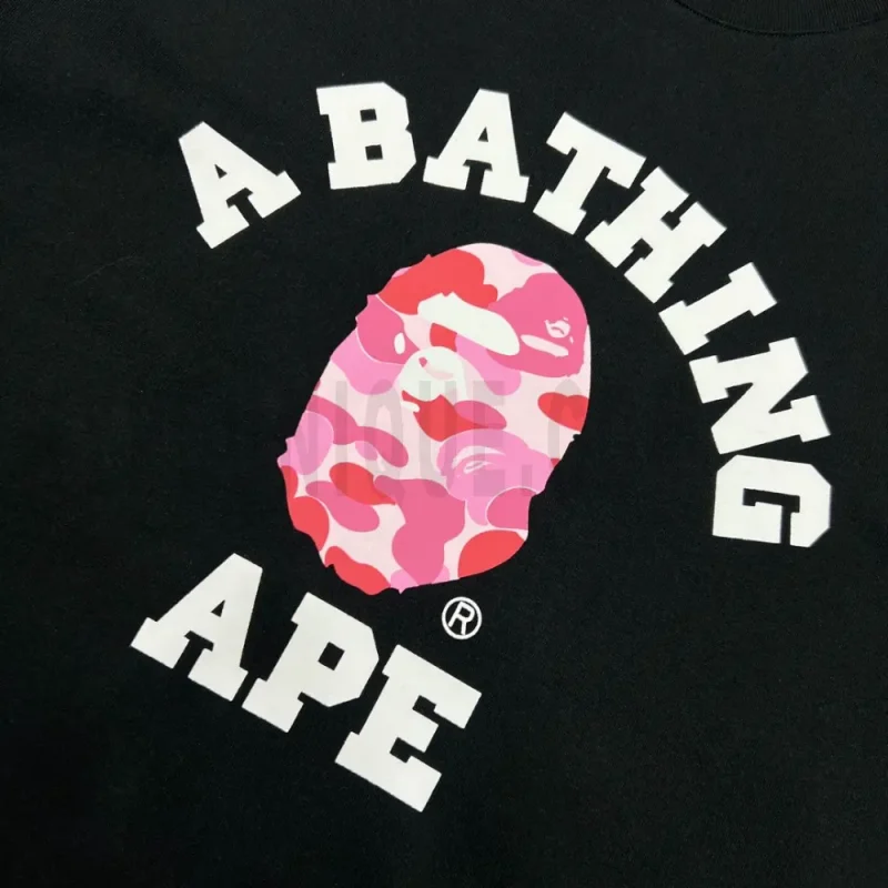Detailed shot capturing the graphic print on the black tee's front panel.