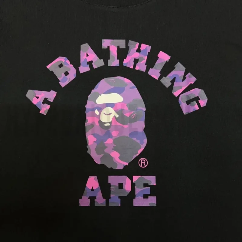 Detailed shot capturing the graphic print on the black tee's front panel.