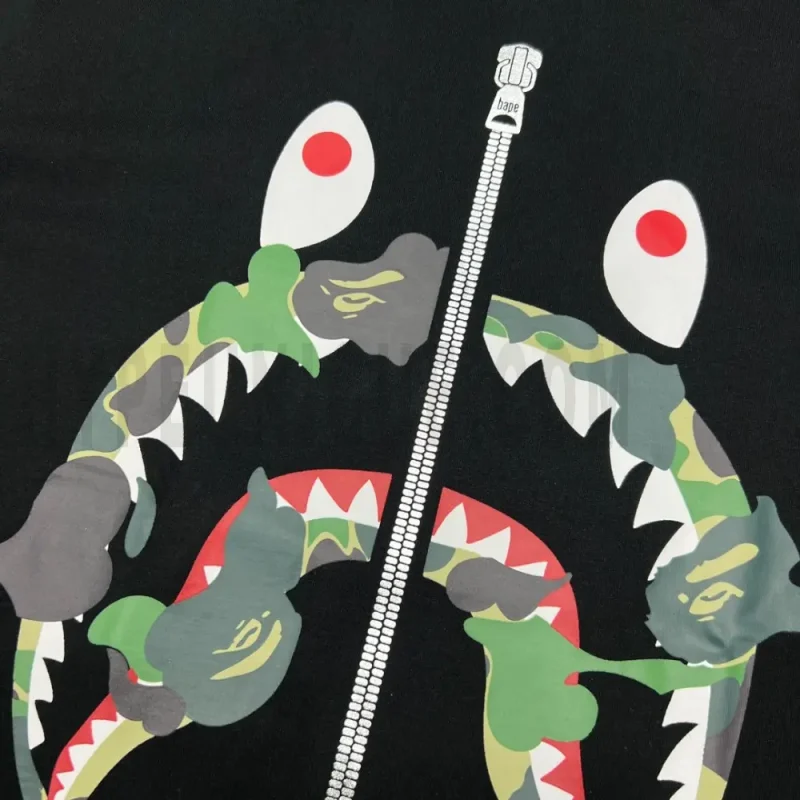 Detailed shot capturing the graphic print on the black tee's back panel.