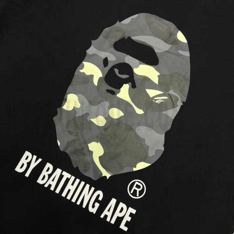 Detailed shot capturing the graphic print on the black tee's front panel.