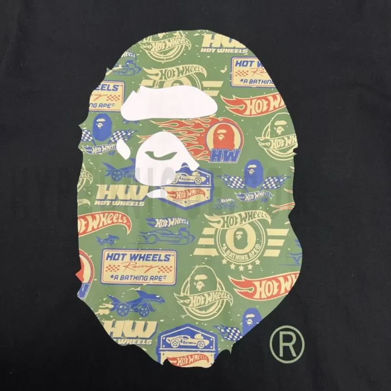 Detailed shot capturing the graphic print on the black tee's front panel.