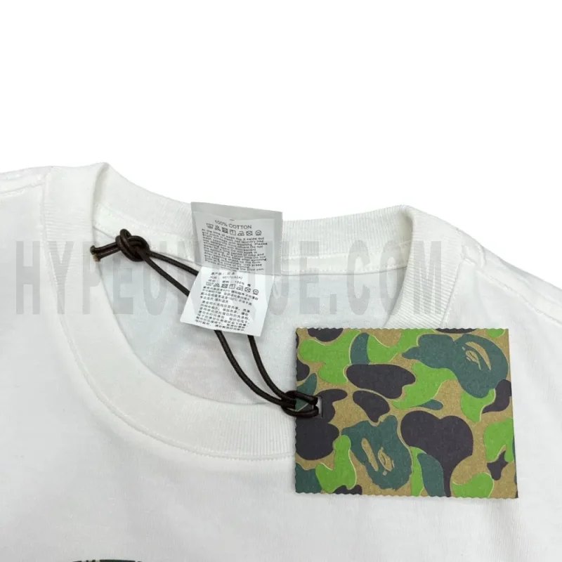 Close-up detail of the neck tag, showcasing care instruction icons and elevated brand labeling—designed with a contemporary aesthetic edge.