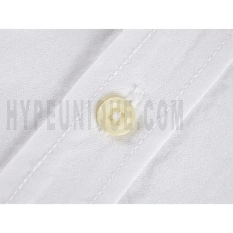 Close-up of button detail on the garment