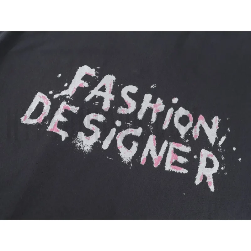 Detailed shot capturing the graphic print on the black tee's front panel.