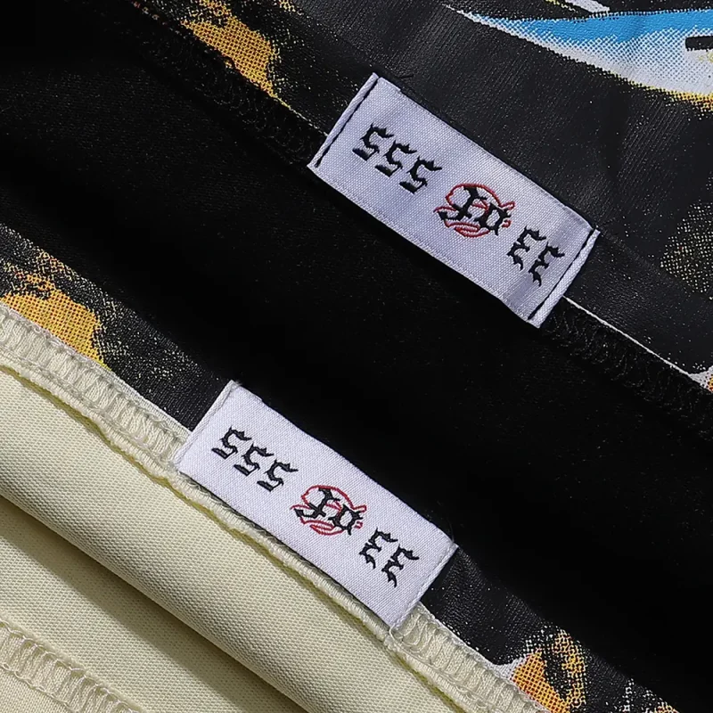 Clean hemline finish with a modern cut, highlighting the T-shirt's streetwear aesthetic.