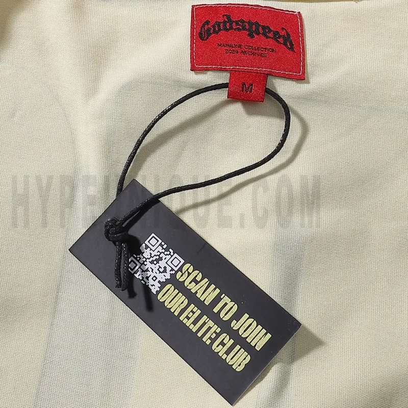 Close-up of the tee's featuring wash care instructions and subtle brand branding in a clean, minimalist typography