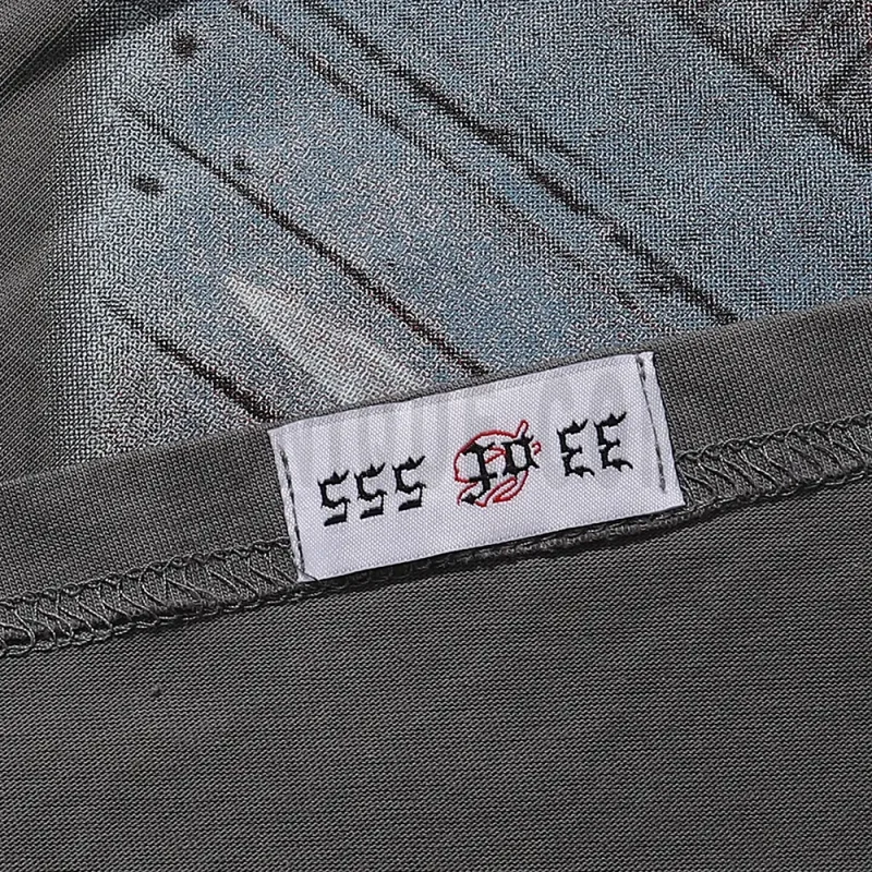 Clean hemline finish with a modern cut, highlighting the T-shirt's streetwear aesthetic.