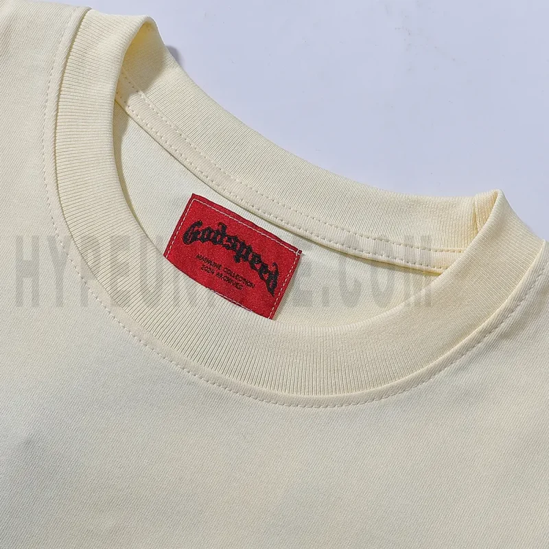 Close-up of the T-shirt's neckline tag, showcasing wash care instructions and brand details in a fashion design.