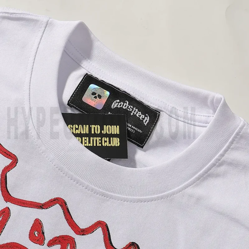 Close-up of the T-shirt's neckline tag, showcasing wash care instructions and brand details in a fashion design.