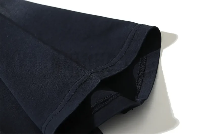 Precision cutting and sewing techniques on sleeves.