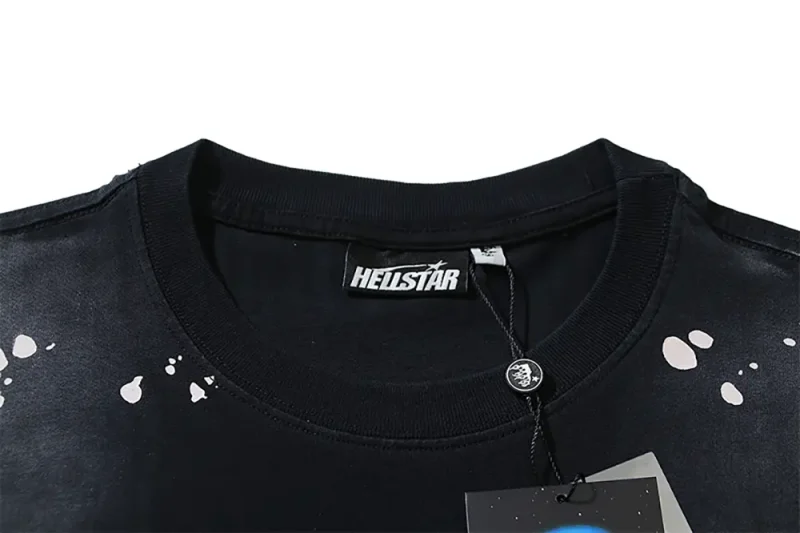Close-up of the T-shirt's neckline tag, showcasing wash care instructions and brand details in a fashion design.