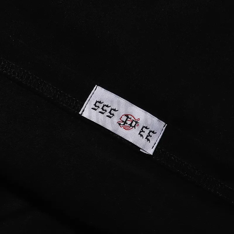 Clean hemline finish with a modern cut, highlighting the T-shirt's streetwear aesthetic.