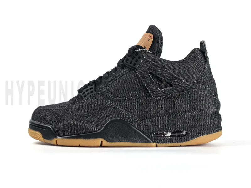 Detailed view of the heel on the Air Jordan 4 Retro Levi’s Black GS, highlighting the brown Levi’s patch on the black denim upper.