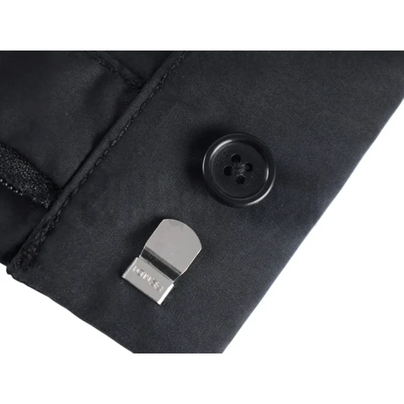 Close-up of button detail on the pants