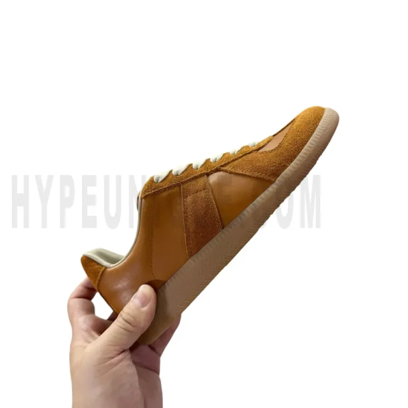 The right side of the brown shoes