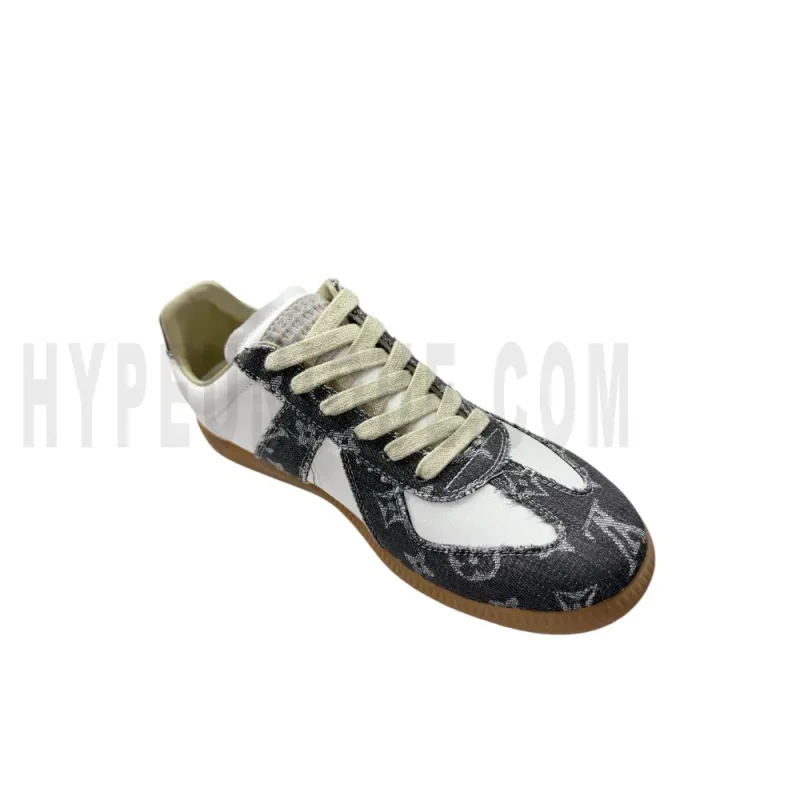 The left of the white and dark gray shoes