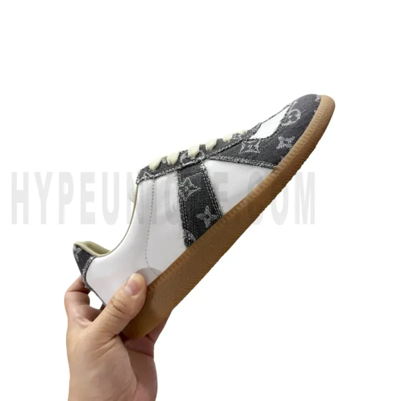 The right side of the white and dark gray shoes